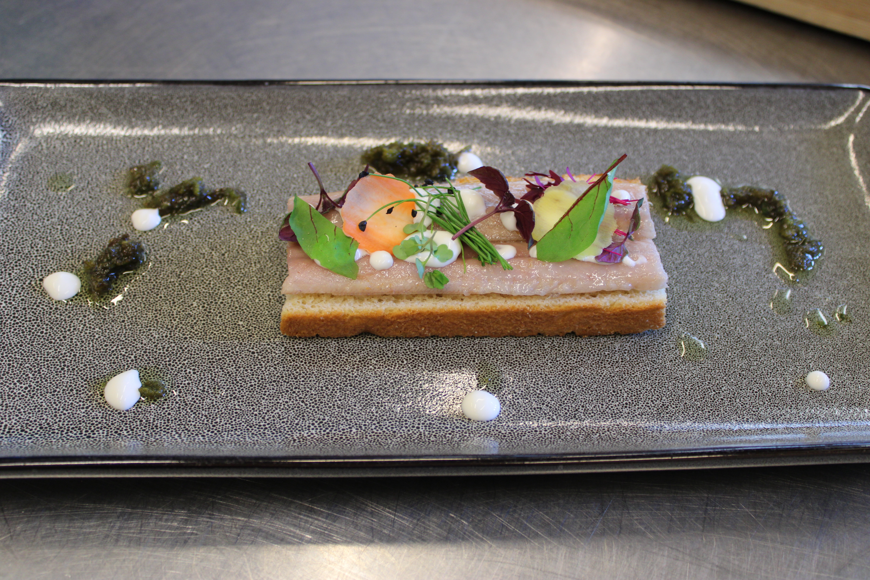 Eel on toast with azolla oil